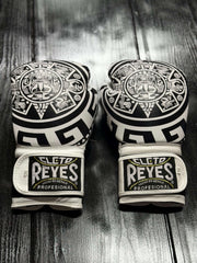 Cleto Reyes Professional boxing gloves in white featuring an intricate black Aztec calendar and tribal art design layout Back View