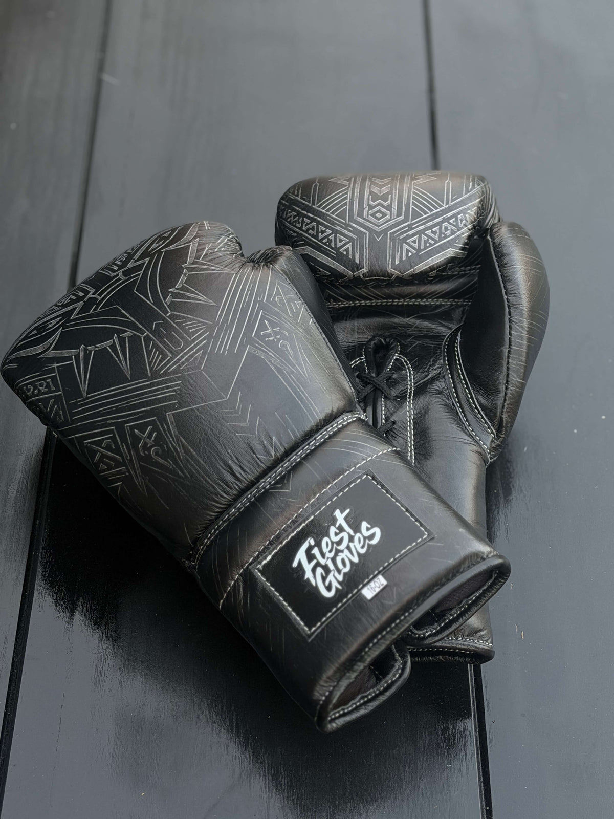 Fiest Panther Style Black Boxing Gloves - showing intricate panther print design and Fiest Gloves logo on the wrist strap.