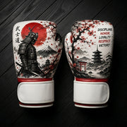 White and red boxing gloves featuring a Japanese samurai, red sun, Mount Fuji, cherry blossoms, a pagoda temple, Torii gate, and discipline values text for combat sports training.