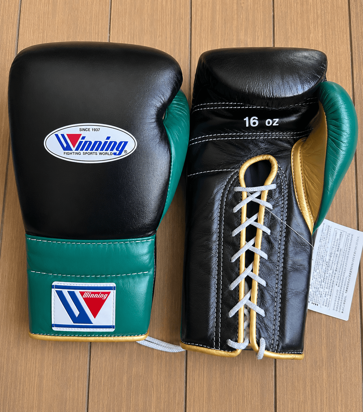 Winning Boxing Gloves Black/Green/Gold on Hands Training Action Shot