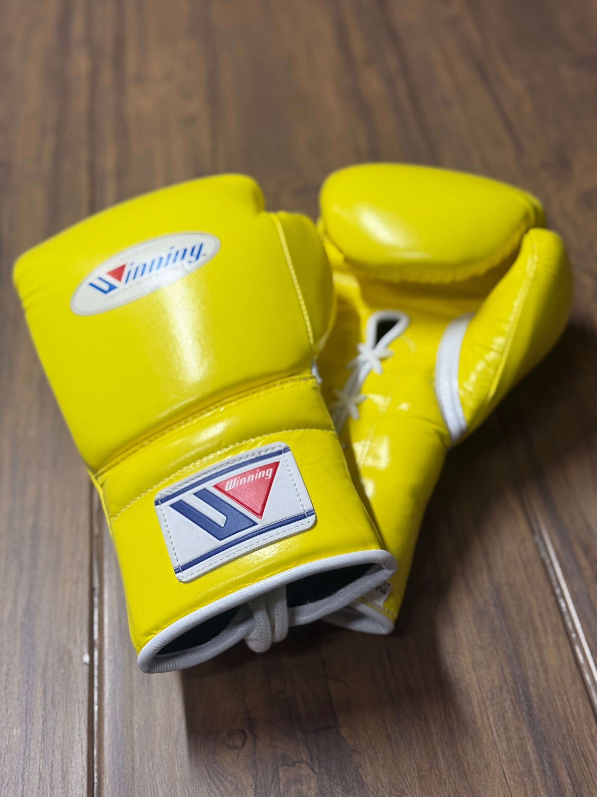 Winning boxing gloves yellow back and front view for heavy bag and sparring