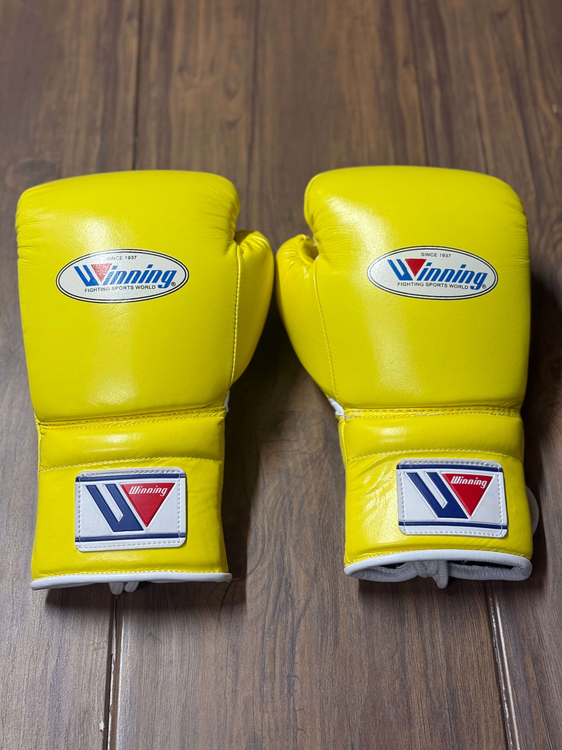Winning boxing gloves yellow back view for heavy bag and sparring