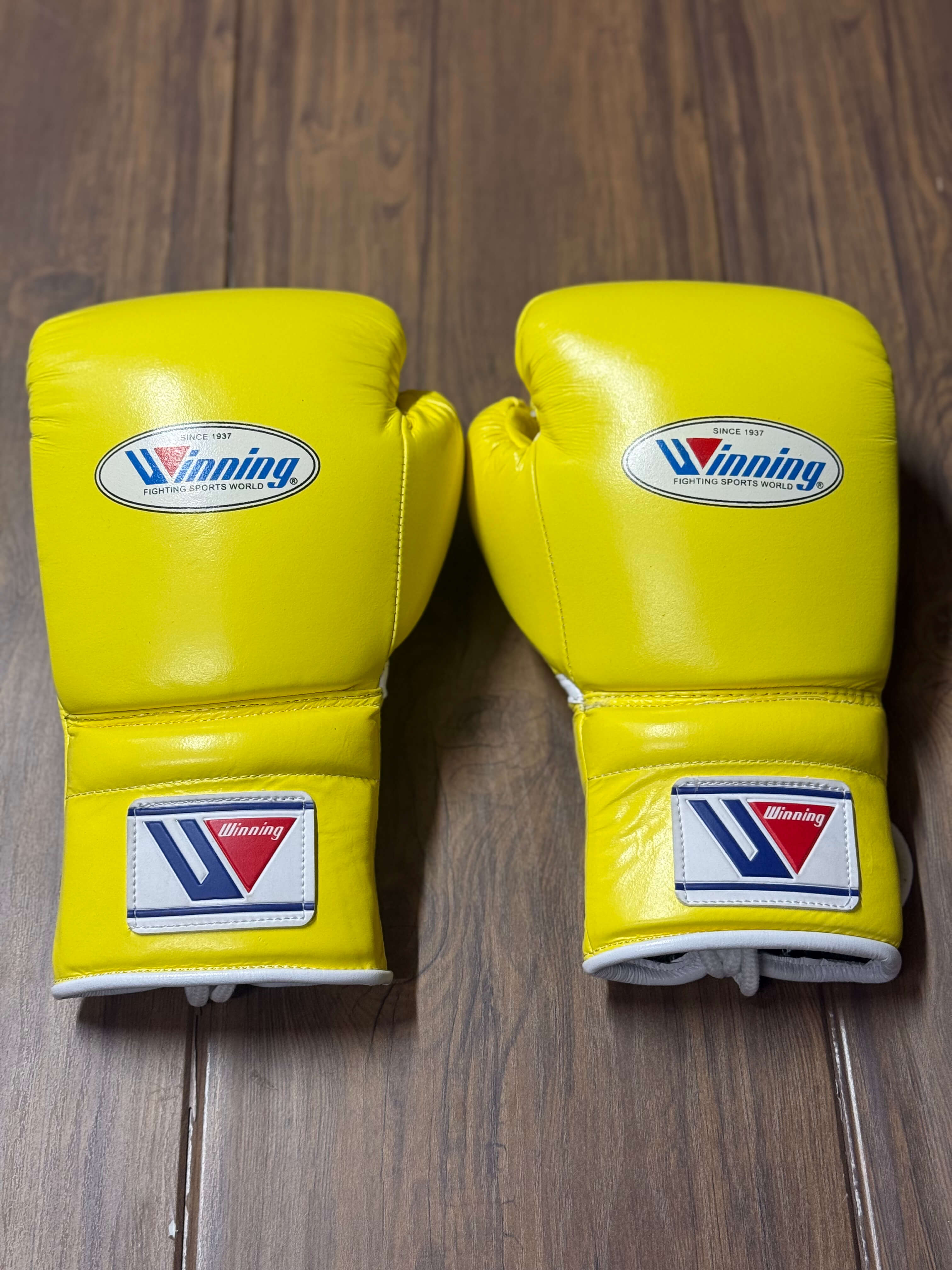 Winning boxing gloves yellow back view for heavy bag and sparring