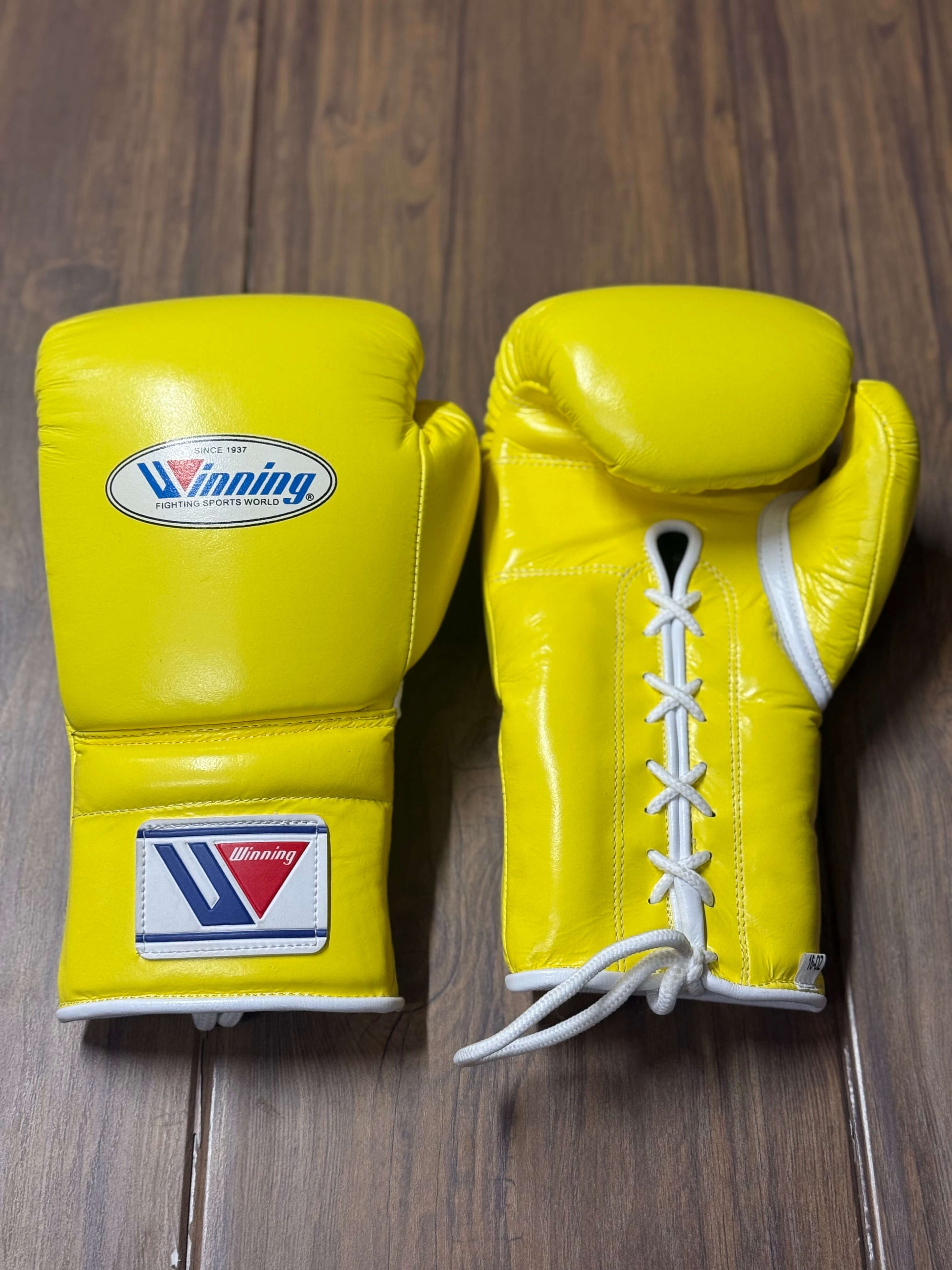 Winning boxing gloves yellow front and back for heavy bag and sparring