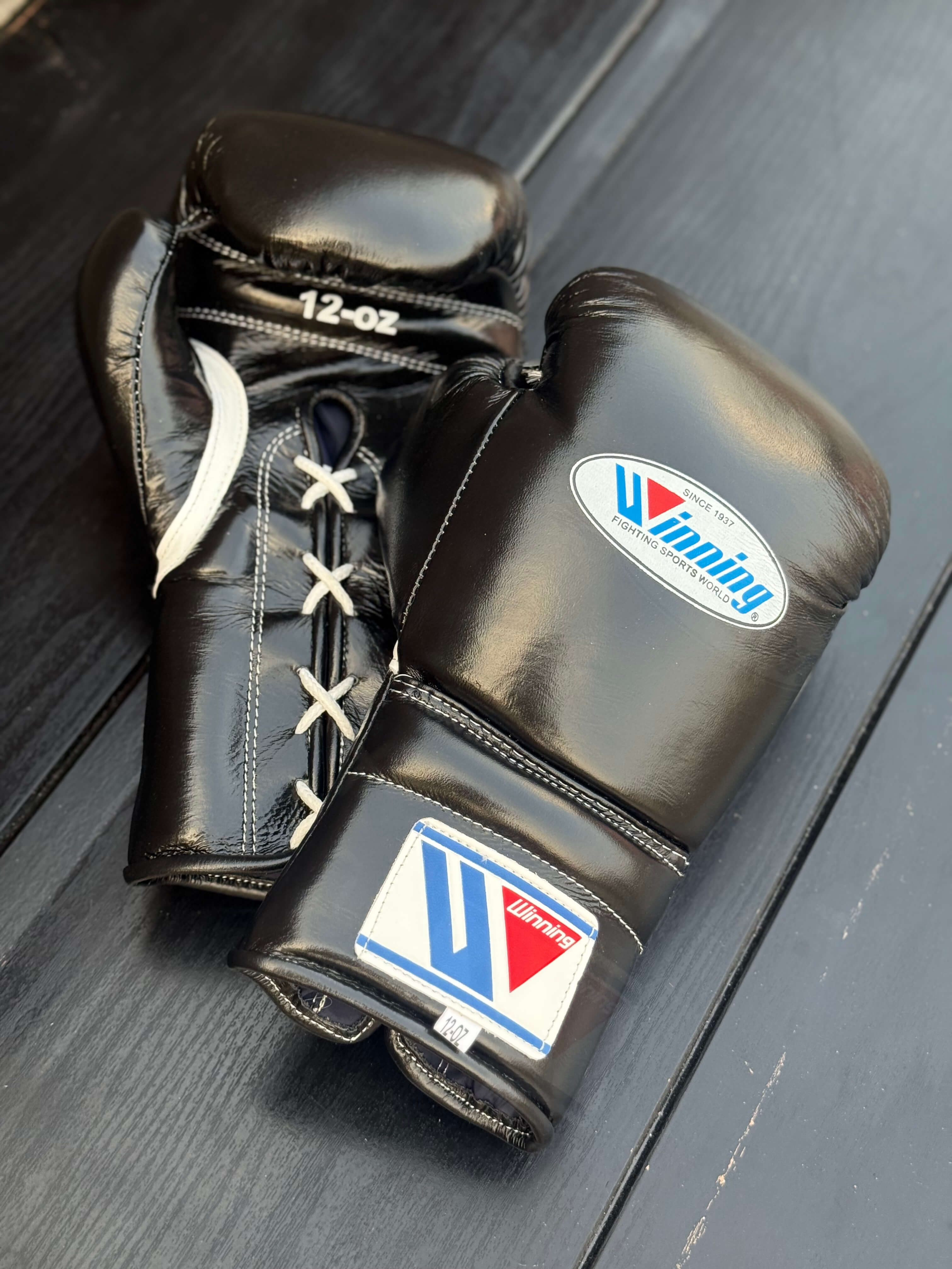 Winning boxing gloves Black lace up back and front view high quality sparring gloves