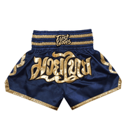 Back view of dark-blue/gold boxing shorts showing logo and fit