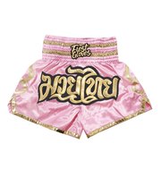 Fighter wearing Pink/Gold boxing shorts during training session