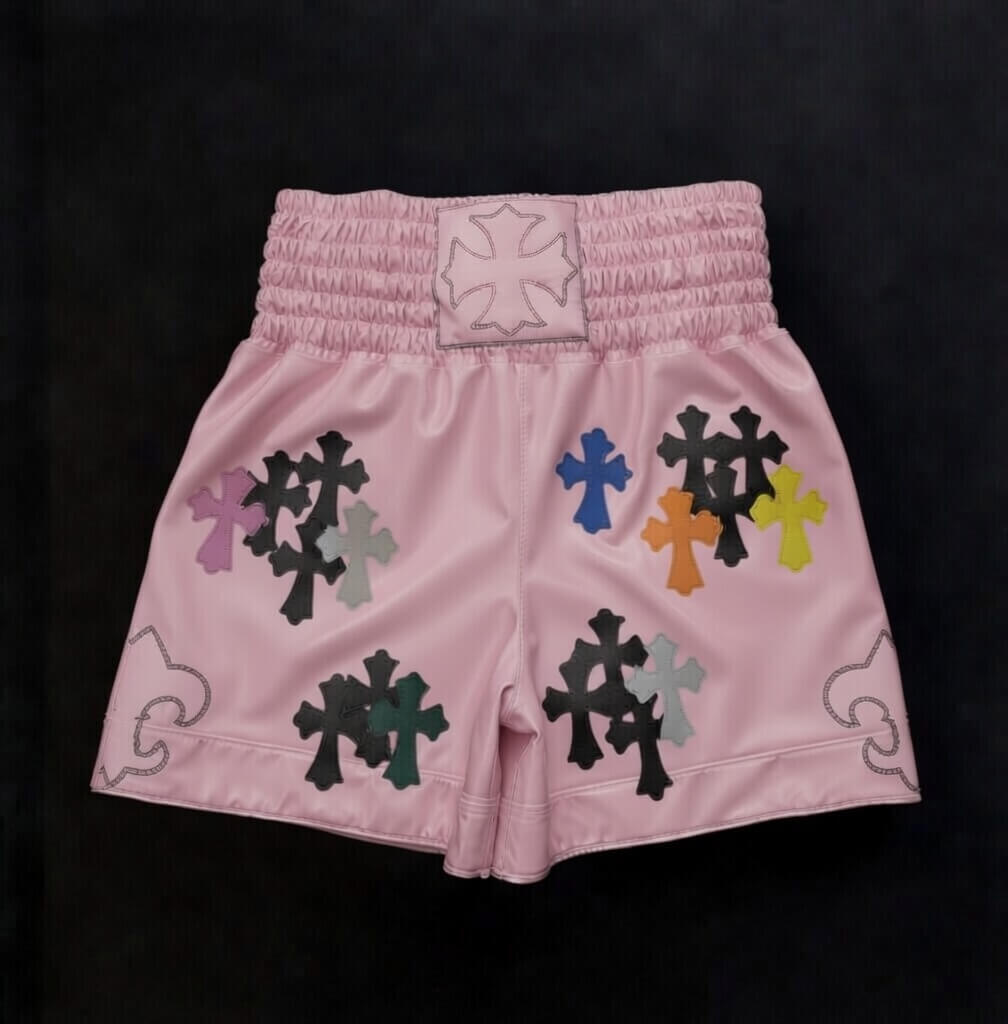 Chrome Hearts style pink boxing shorts with silver cross and dagger print front view