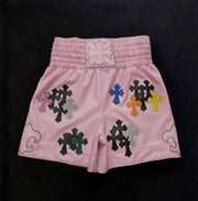 Chrome Hearts style pink boxing shorts with silver cross and dagger print front view