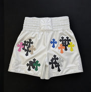 Designer Chrome Hearts style boxing shorts worn by model in gym setting