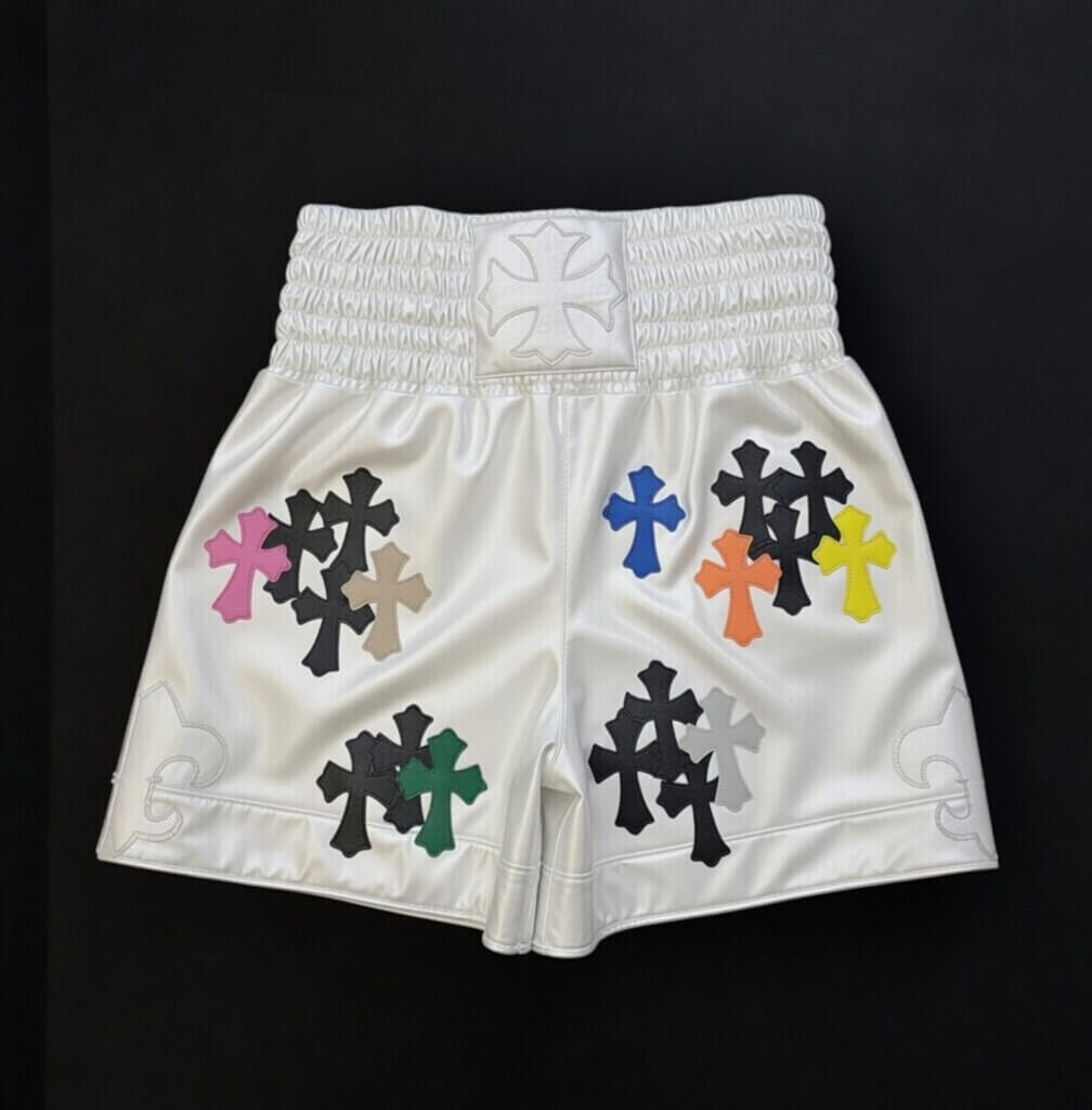 Designer Chrome Hearts style boxing shorts worn by model in gym setting