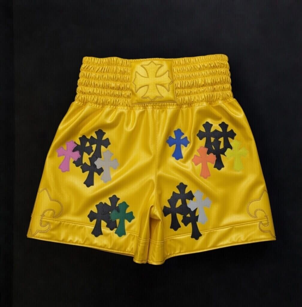 Men's luxury Yellow Chrome Hearts style combat shorts laid flat