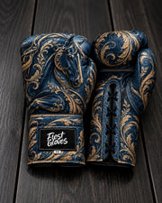 Blue leather boxing gloves with gold filigree and embossed horse design by Fiest Gloves.