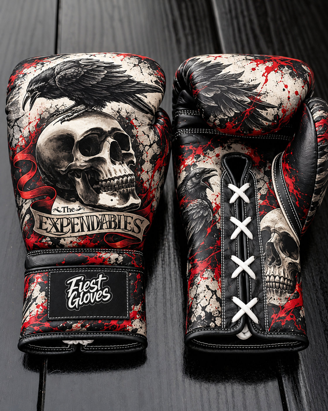 Fiest Gloves featuring a black raven perched on a skull with a banner reading 'The EXPENDABLES', red splatter accents, and white laces on a dark wooden background.   