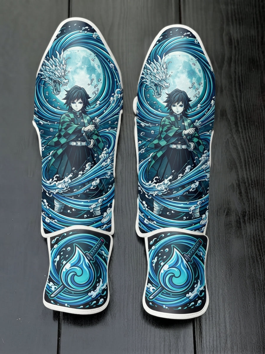 Custom Giyu Tomioka Water Hashira anime design with water dragon, moon, and blue water drop sword symbol soccer shin guards displayed on a dark surface.