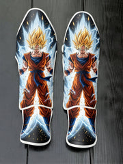 Custom Super Saiyan Goku anime design soccer shin guards displayed on a dark wooden background.
