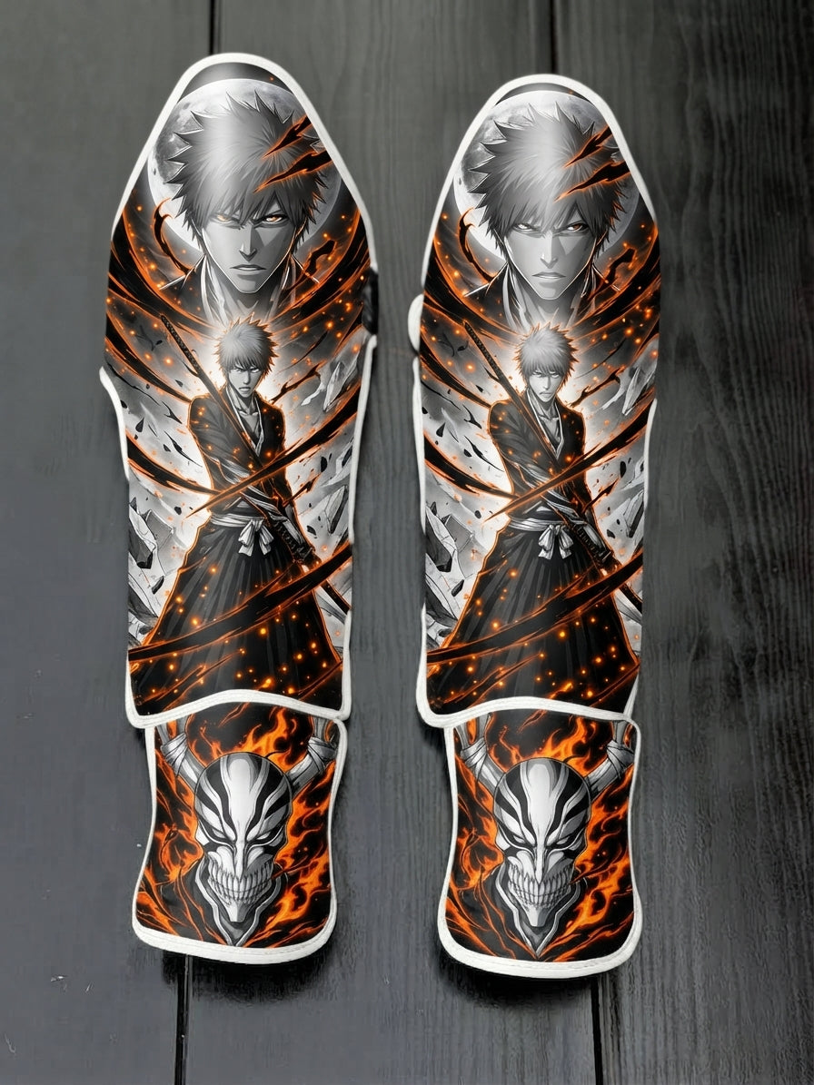 Custom Ichigo Kurosaki Soul Reaper anime design with flaming background and horned Hollow mask soccer shin guards displayed on a dark surface.