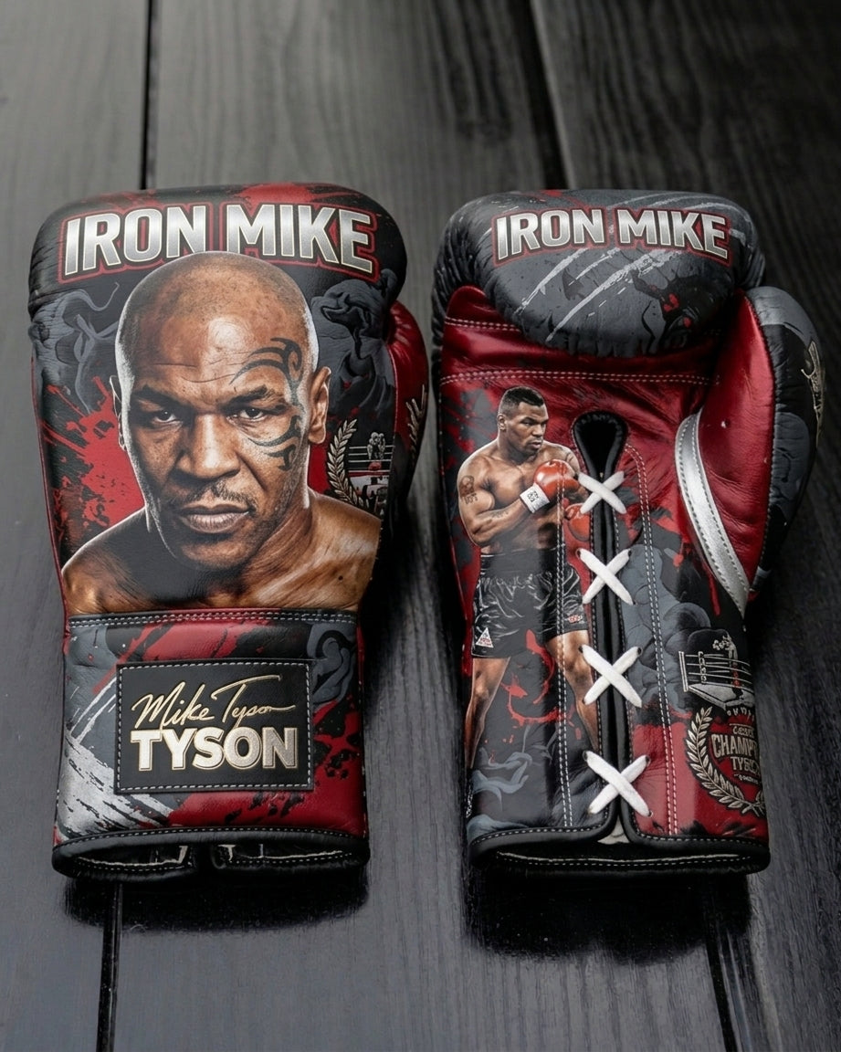 Custom black and red leather boxing gloves featuring a realistic portrait of Mike Tyson, 'Iron Mike' lettering, signature wrist patch, and white lace-up closure.