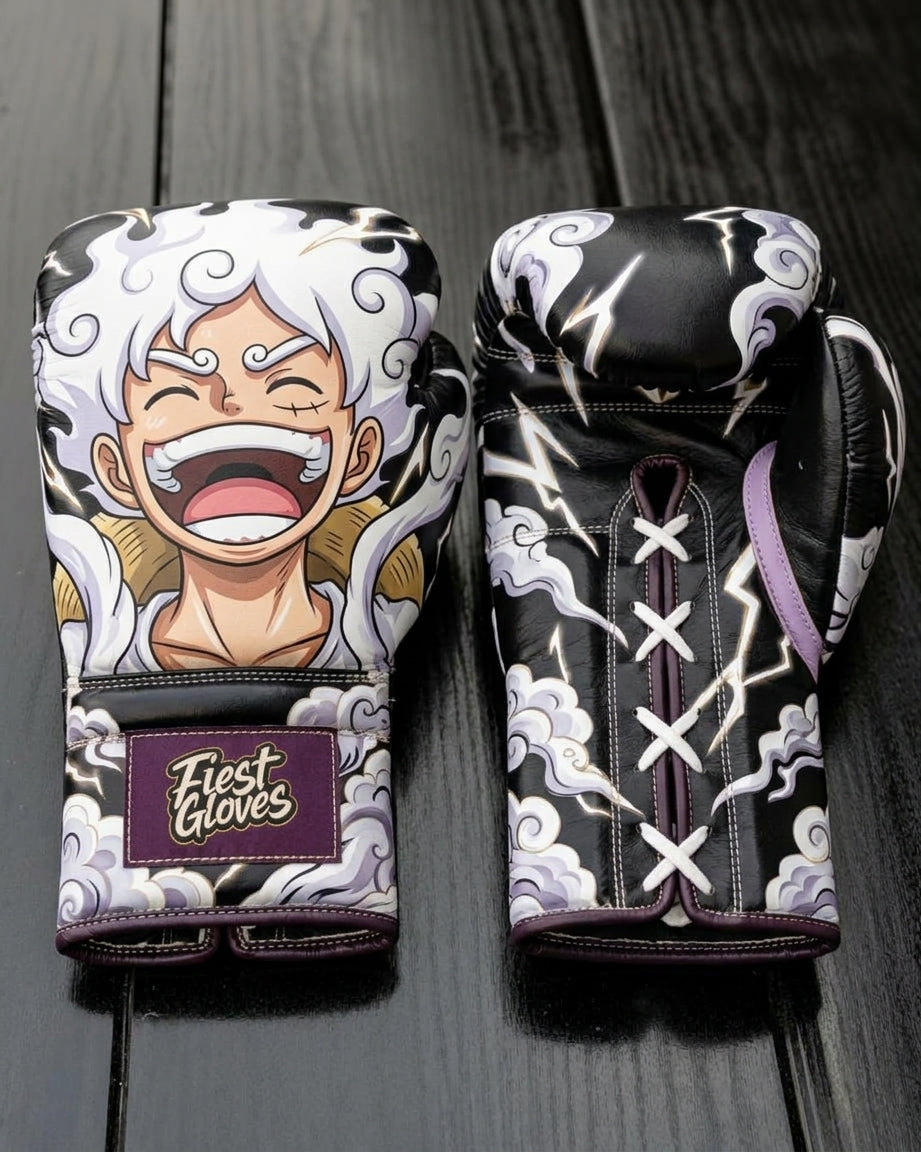 Custom boxing gloves featuring a laughing Monkey D. Luffy in One Piece Gear 5 form with white hair and smoke clouds on a dark black background, complete with a "Fiest Gloves" patch on the cuff.