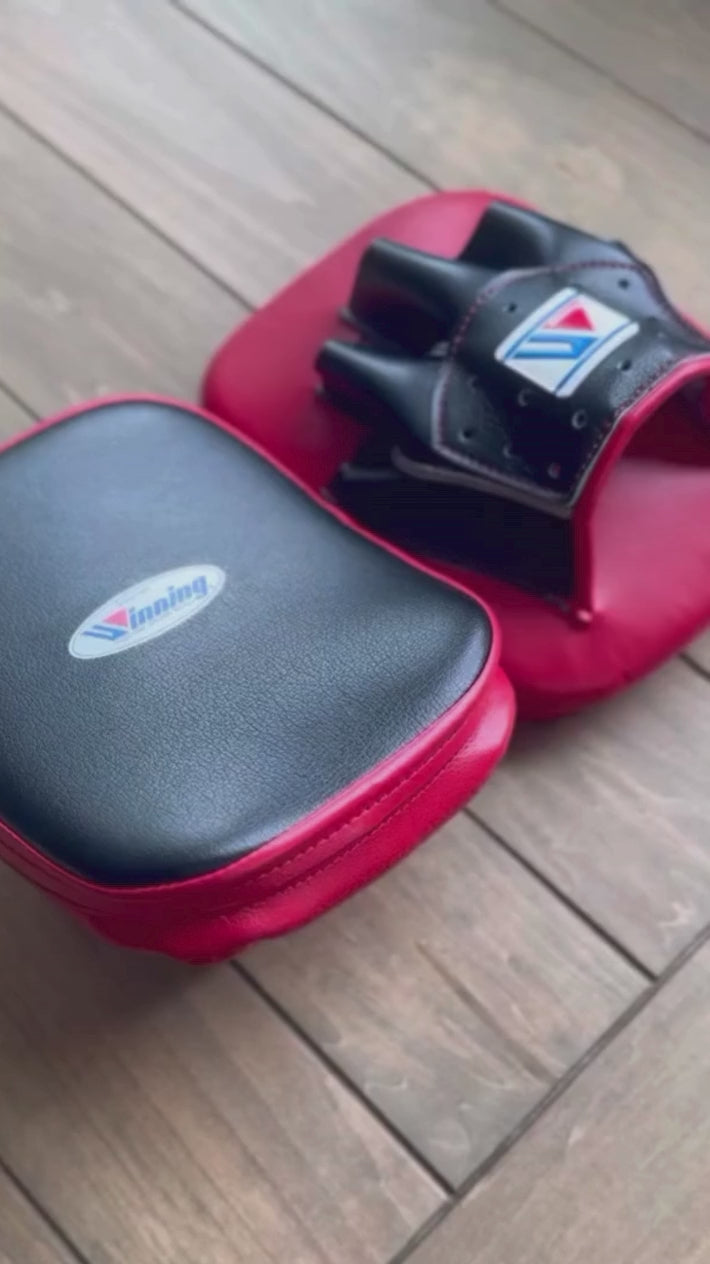 Load video: Winning Curved Focus Mitts | Black/Red