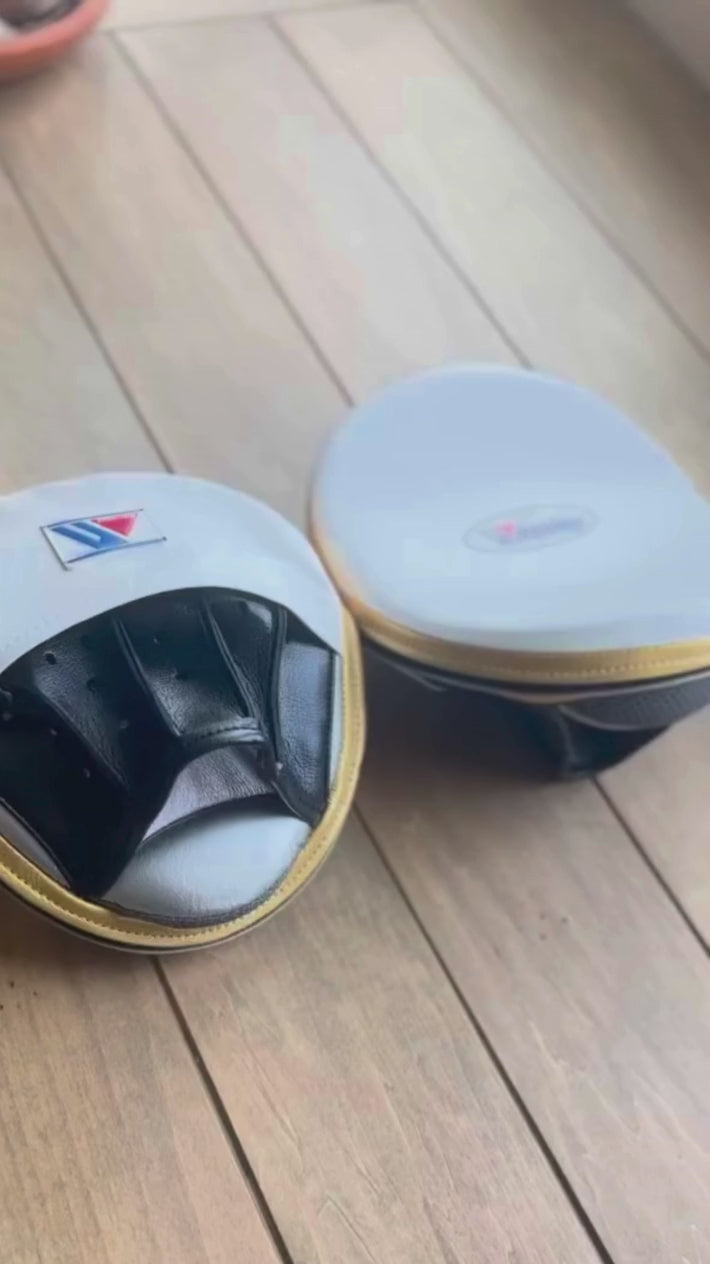 Load video: Winning Punching Mitts | White/Black/Gold