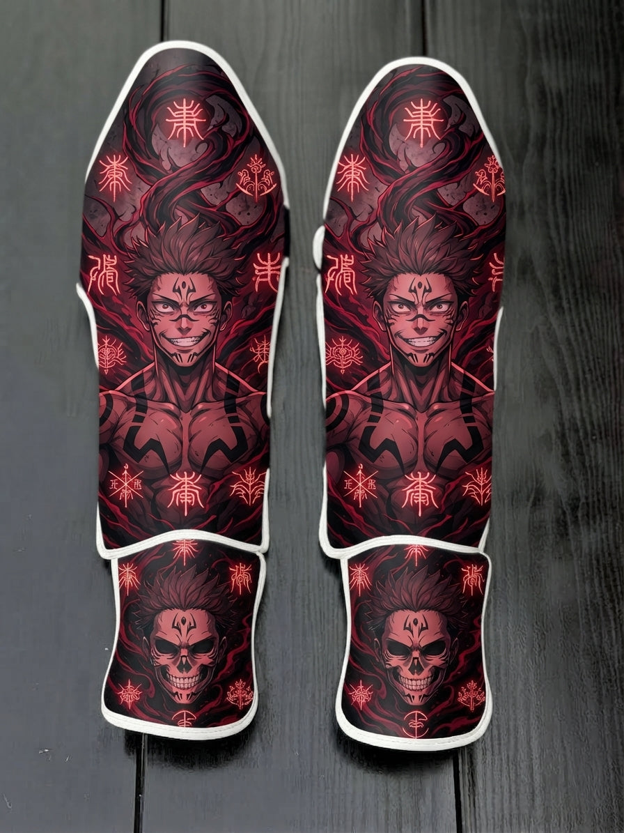 Custom Ryomen Sukuna anime design with facial tattoos, glowing red cursed symbols, and a demonic skull graphic soccer shin guards displayed on a dark surface.