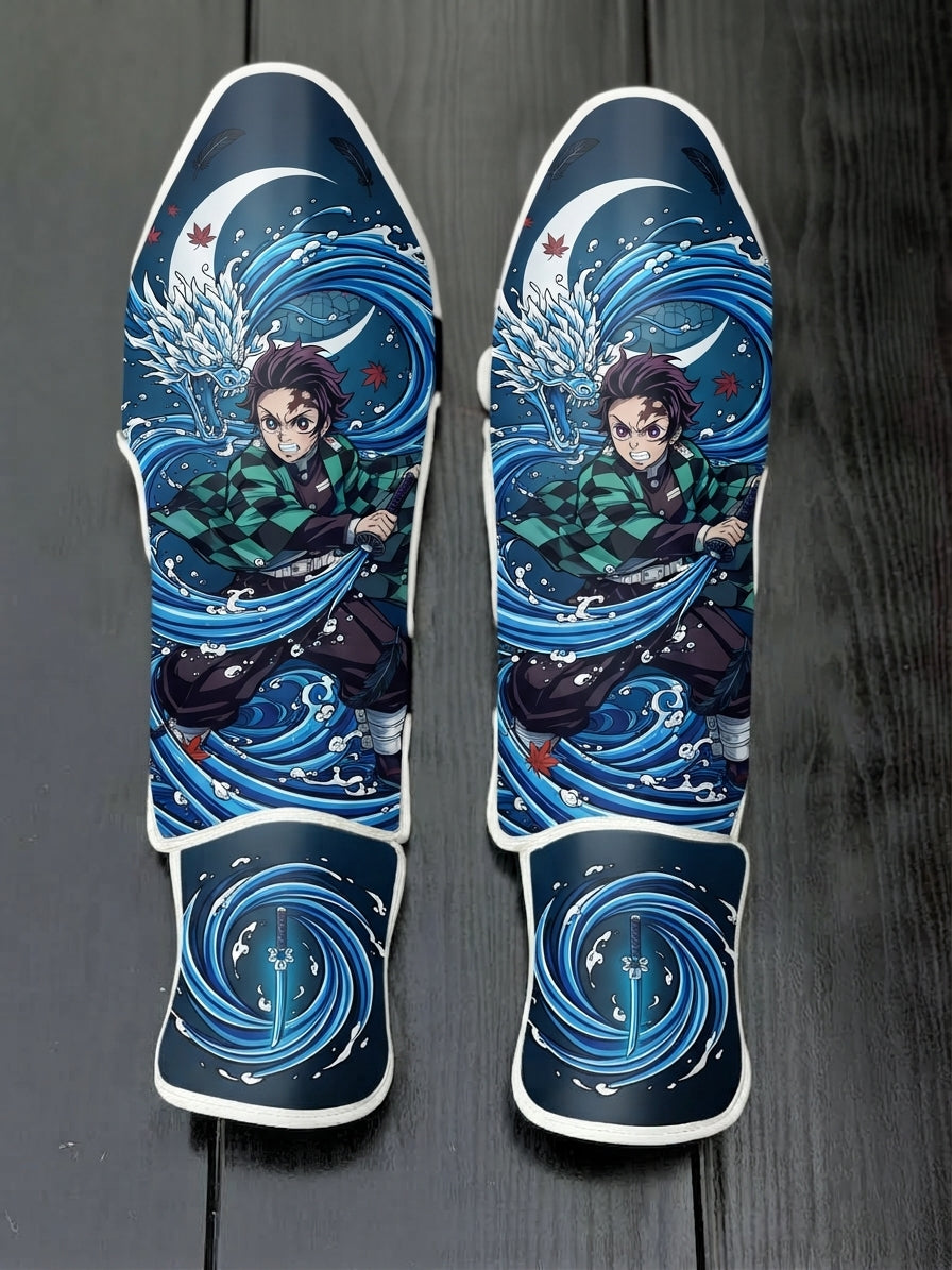 Custom Tanjiro Kamado Water Breathing technique anime design with blue dragon waves and Nichirin sword soccer shin guards displayed on a dark surface.